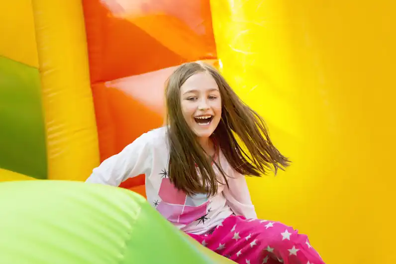 Little Girl Having Fun in Bouncy House
